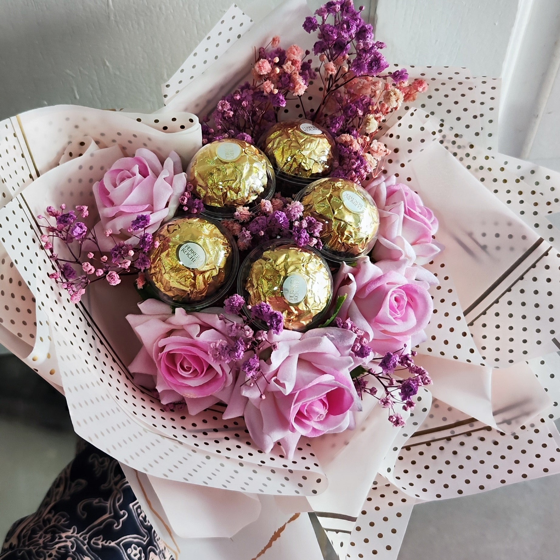 Blushing Bloom Bouquet of Flowers consists of baby breath's and roses and paired with 5 Ferrero Rocher Chocolates