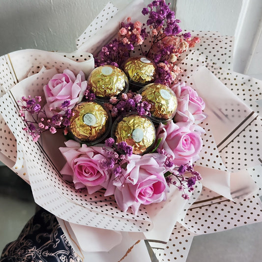 Blushing Bloom Bouquet of Flowers consists of baby breath's and roses and paired with 5 Ferrero Rocher Chocolates